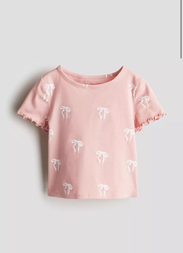Remera moñitos H&M manga corta